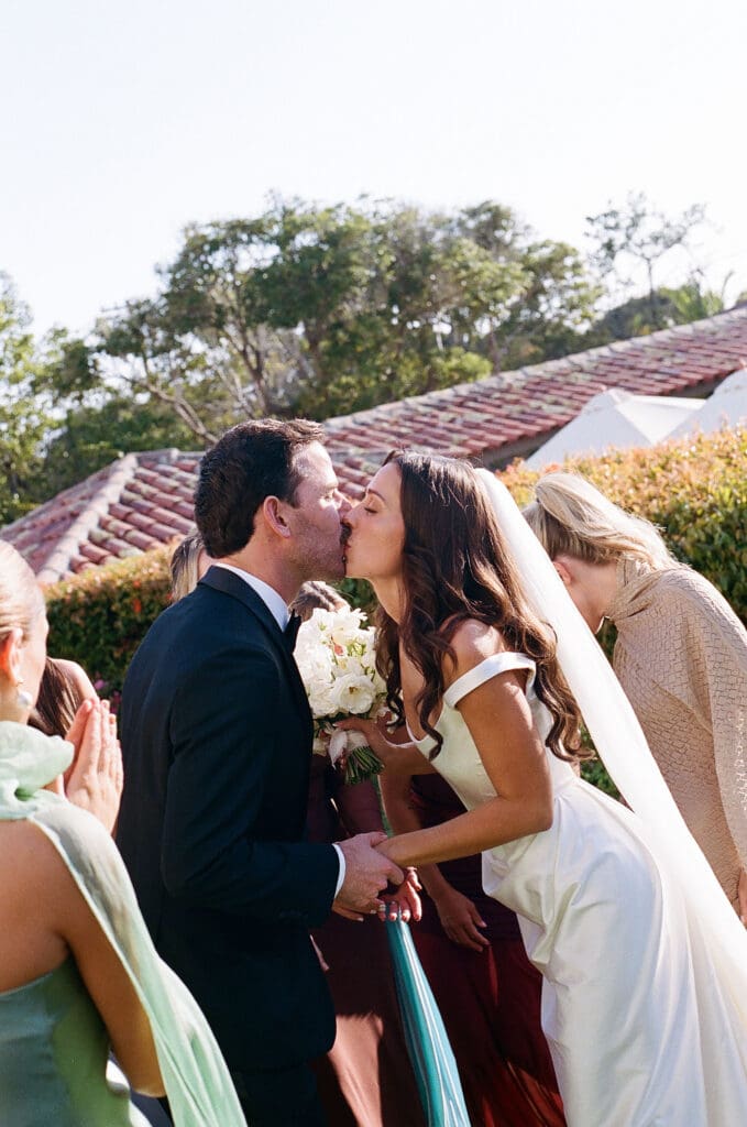portrait of the newlyweds kissing