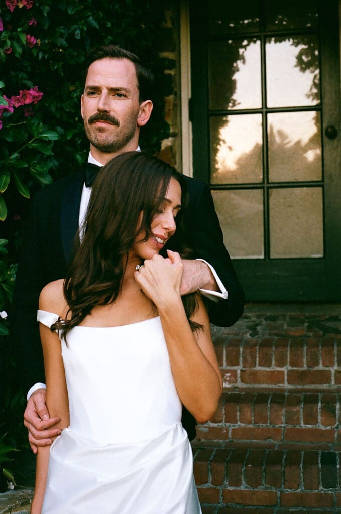 bride and groom holding hands