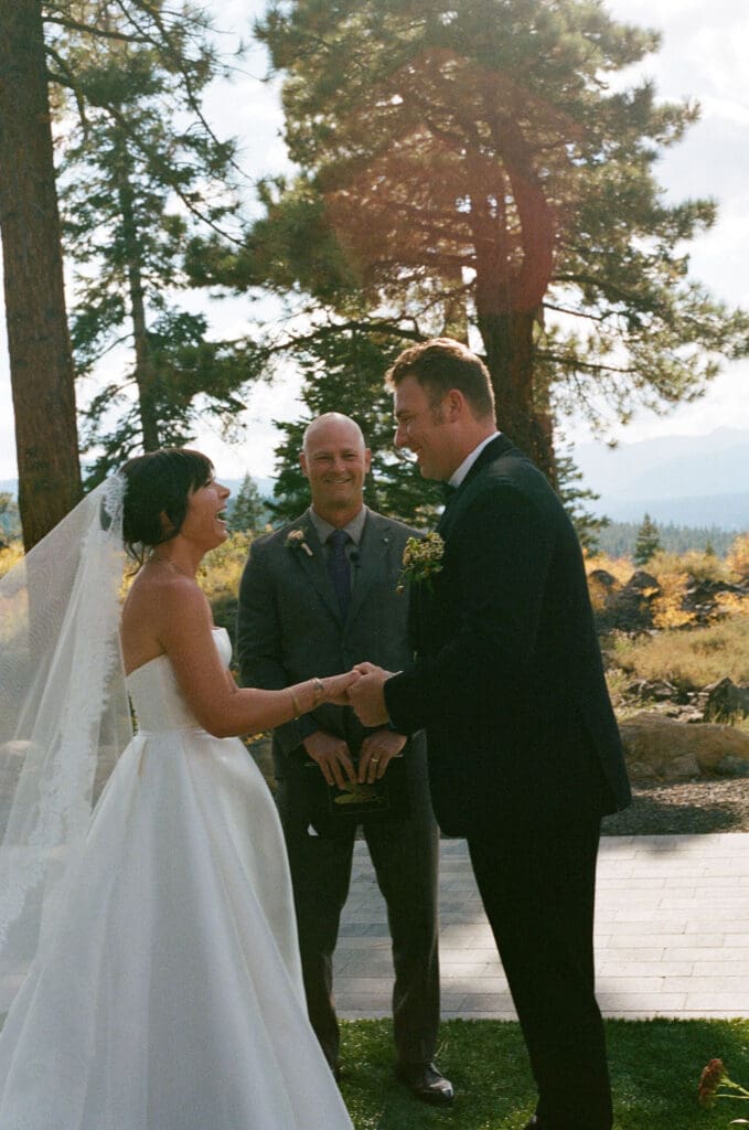 bride and groom holding hands during their wedding ceremony