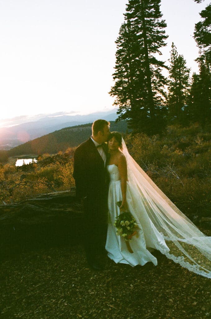 groom kissing the bride on the forehead