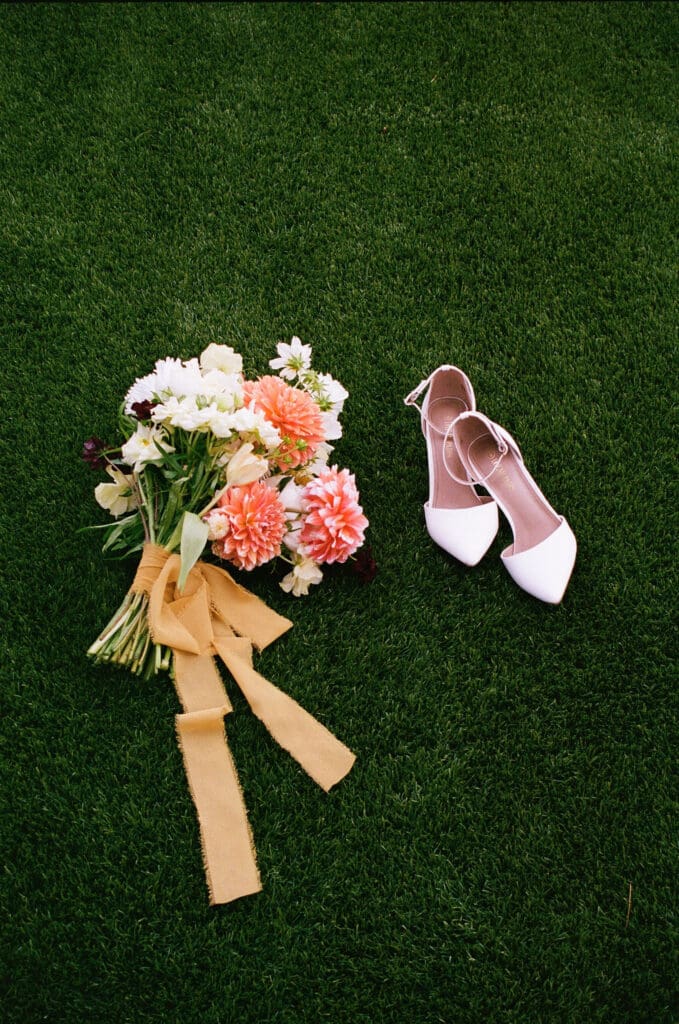 Stunning portrait of the wedding shoes, and the wedding bouquet