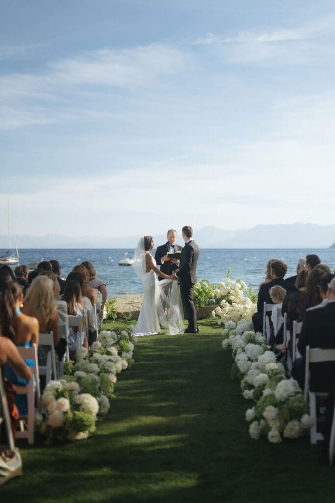 bride and groom holding hands during their wedding ceremony