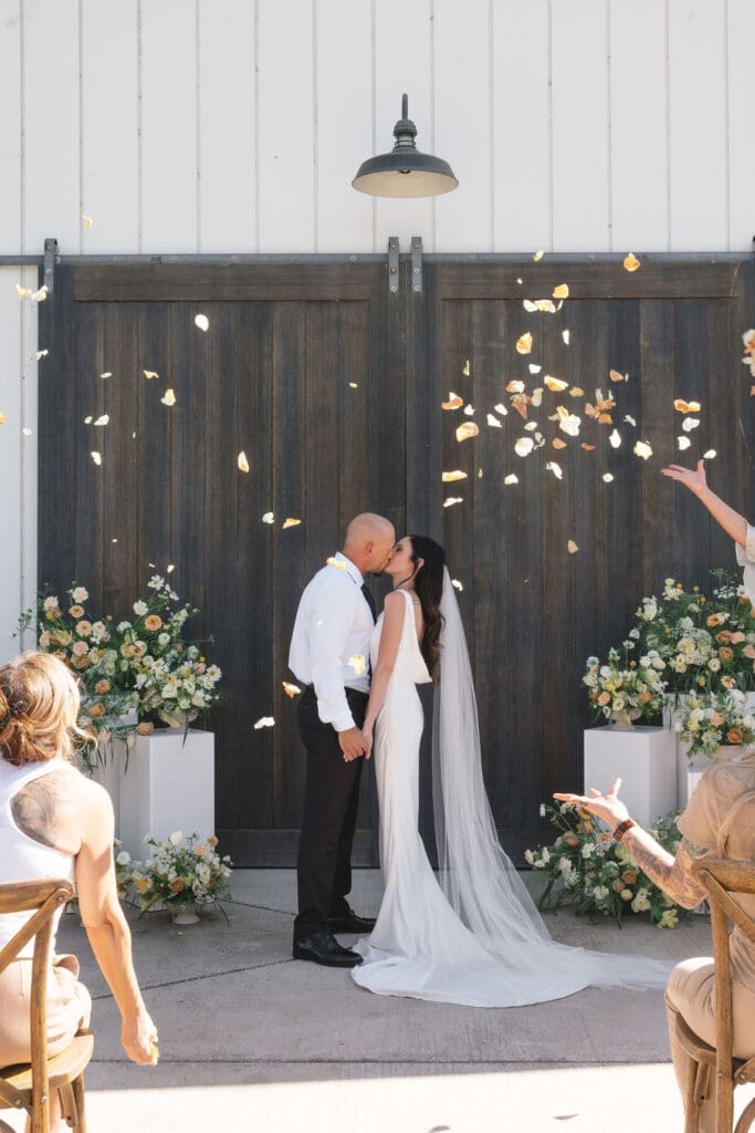 cute picture of the bride and groom kissing