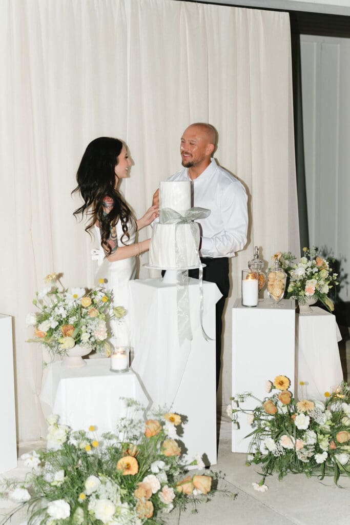 newlyweds cutting their wedding cake
